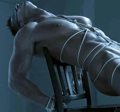 hot-guy-tied-to-chair-rope-bondage
